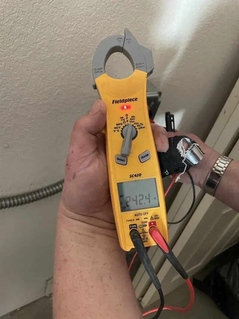 Voltage testing with clamp meter during Electrical Installation Services in Hillsdale